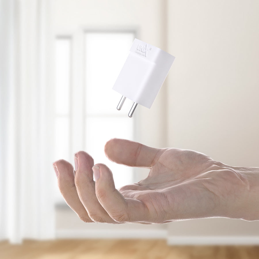 Unix UX-101 Micro USB Travel Charger in hand
